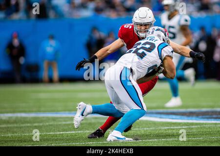 Charlotte, NC, USA. 2nd Oct, 2022. Arizona Cardinals linebacker Ben Niemann  (56) tackles Carolina Panthers running back Christian McCaffrey (22) during  the second quarter of the NFL matchup at Bank of America