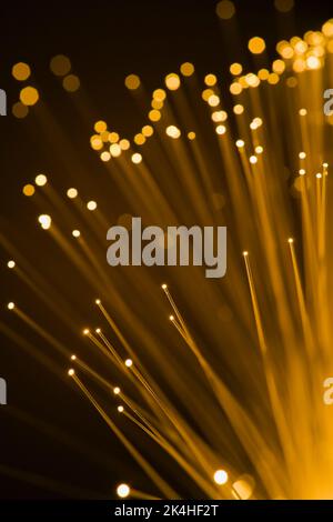 Yellow lighted fibre optic strands. Stock Photo