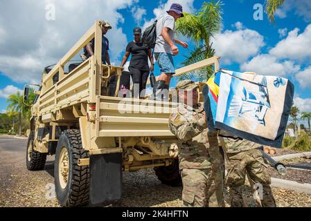 North Port, Florida, USA. 1st Oct, 2022. Soldiers from the National Guard 753rd Brigade Engineering Battalion assist evacuees fleeing rising flood waters of the Myakka River, in the aftermath of Hurricane Ian, at Foundation Church. (Credit Image: © Jerry D Beard/ZUMA Press Wire) Stock Photo