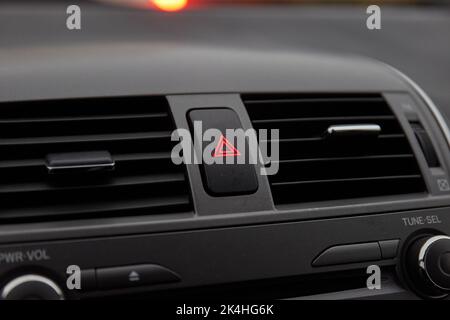 Dashboard hazard light button in stopping traffic Stock Photo