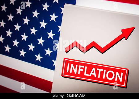 Conceptual keyword Inflation on card on US flag. Increase in the prices of goods or services and economic crisis concept. Business, economy, social co Stock Photo
