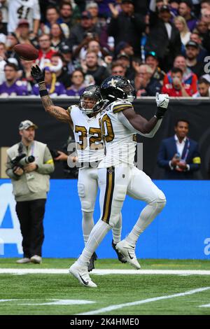 New Orleans, Louisiana,, November 7, 2022. New Orleans Saints safety Tyrann  Mathieu (32) tackles Baltimore Ravens quarterback Lamar Jackson (8) during  a National Football League game at Caesars Superdome in New Orleans