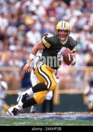 Green Bay Packer quarterback Brett Favre looks downfield during game action at Lambeau Field, ca. 1996. Stock Photo