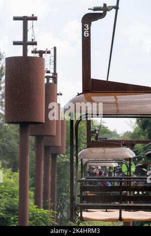 rusty old cable car, cable car ride in the rain, views of the canyon, vegetation and people. Mexico Stock Photo