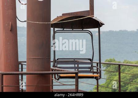 rusty old cable car, cable car ride in the rain, views of the canyon, vegetation and people. Mexico Stock Photo