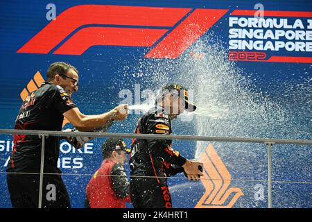 Singapore. 2nd Oct, 2022. Red Bull's Mexican driver Sergio Perez (R) celebrates during the trophy ceremony after winning the Formula One Singapore Grand Prix Night Race at the Marina Bay Street Circuit in Singapore, on Oct. 2, 2022. Credit: Then Chih Wey/Xinhua/Alamy Live News Stock Photo