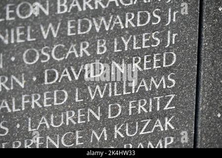 Close up of then name David Neal Reed etched on the Vietnam Memorial Wall in Washington, DC. David Reed died from combat wounds on December 23, 1969. Stock Photo