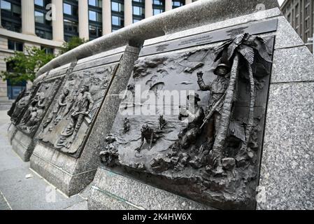 Relief panel depicting Navy Seals special operations forces at the US Navy Memorial located next to the Navy Heritage Center in Washington, DC. Stock Photo