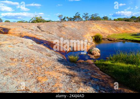 Petrudor Rocks and water hole and Granite Stone landscape, Dalwallinu shire, Western Australia Stock Photo