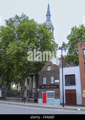 London England - June 15 2009; The Clerk's House traditional building with red door in Shoreditch suburban street. Stock Photo