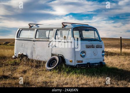 Swift Current, SK/Canada- Sept 11, 2022: Side view of an abandoned Volkswagen van on the Saskatchewan prairies Stock Photo