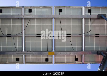 Solar Panels for renewable electrical energy production on the roofs. Back side view. Stock Photo
