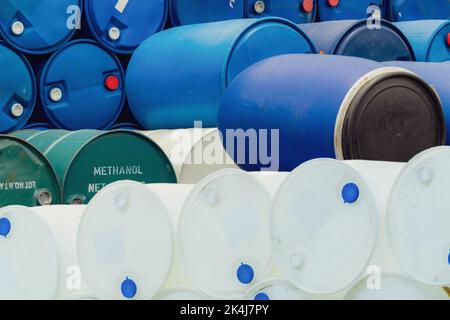 Old chemical barrels. Stack of methanol or methyl alcohol drum. Steel chemical tank. Toxic waste. Plastic and steel chemical barrels. Industrial waste Stock Photo