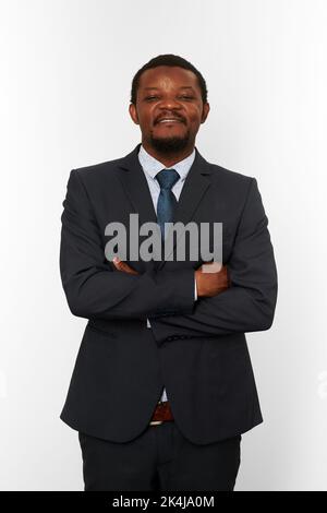 Smiling proud african american black man in business suit with crossed arms on chest isolated on white background. Happy black businessman, chief exec Stock Photo