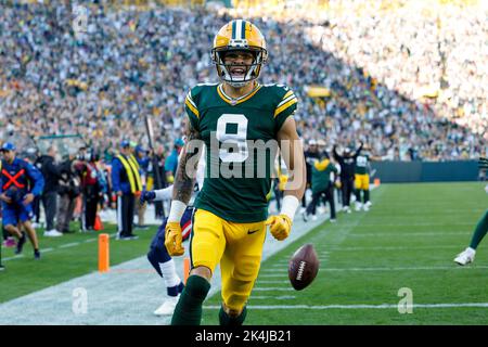 October 2, 2022: Green Bay Packers wide receiver Christian Watson (9)  scoring a touchdown during the NFL football game between the New England  Patriots and the Green Bay Packers at Lambeau Field