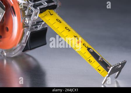 Self-retracting metal tape measure close-up Stock Photo