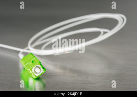 Fiber optical patch cord with SC plug connector close-up Stock Photo