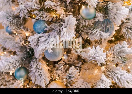 Christmas tree with beautiful decor on the branches close up, holiday concept winter fairy tale, selective focus Stock Photo