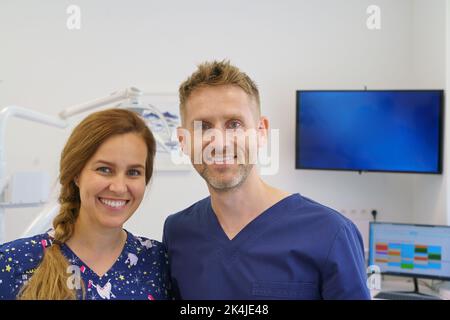 Portrait of dentist posing with nurse in dentists ambulance. Stock Photo