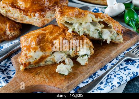 Mini chicken and mushroom puff pastry pies Stock Photo