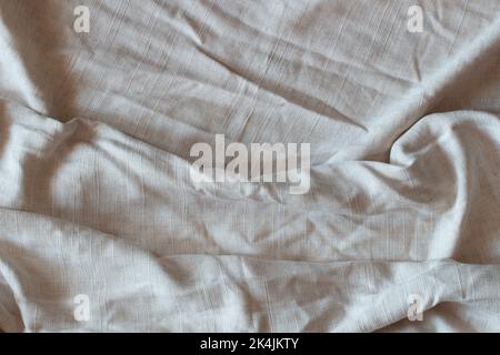 Abstract linen fabric texture background. Crumpled off white linen textiles canvas background. Top view Stock Photo