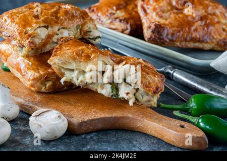 Mini chicken and mushroom puff pastry pies Stock Photo