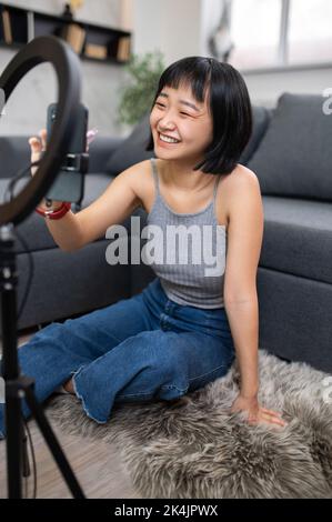 Vlogger preparing for shooting a vlog for her digital followers Stock Photo