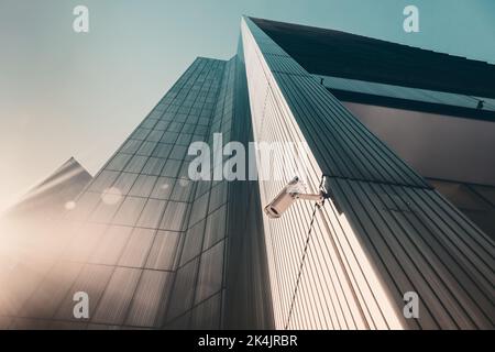 Outdoor street CCTV Security camera installed on the building wall in the city Stock Photo