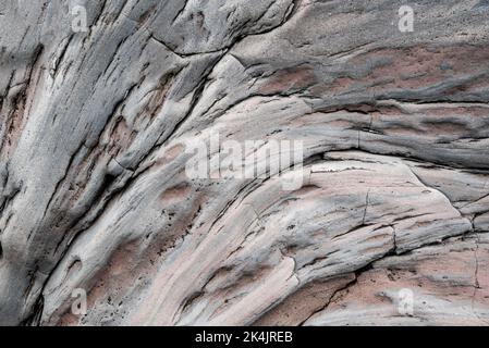 Full-frame close-up of a grey volcanic rock face, probably basalt, in Dritvík Bay, Iceland, suitable as a lava background texture Stock Photo