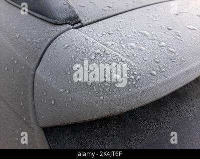 Snow covered car window with wipers, macro, close up Stock Photo