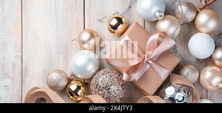 Christmas gifts and decorations on a beige background. The concept of Christmas and New Year. Stock Photo
