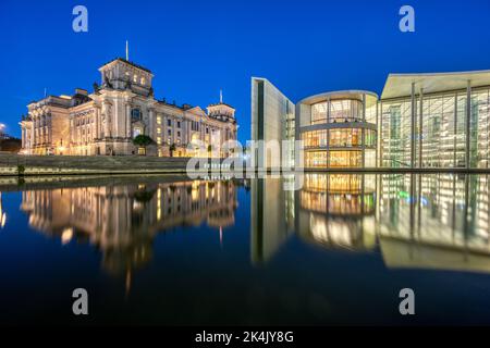 The Reichstag and the Paul-Loebe-Haus at the river Spree in Berlin at night Stock Photo