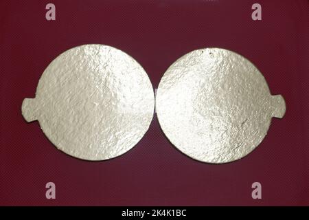 Two golden speech bubbles on a textured red background. Stock Photo