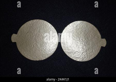 Two golden speech bubbles on a textured red background. Stock Photo