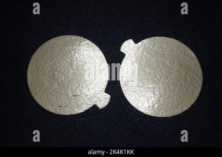 Two golden speech bubbles on a textured red background. Stock Photo
