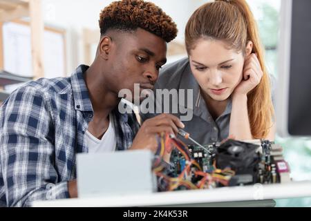 young students testing project in workshop Stock Photo