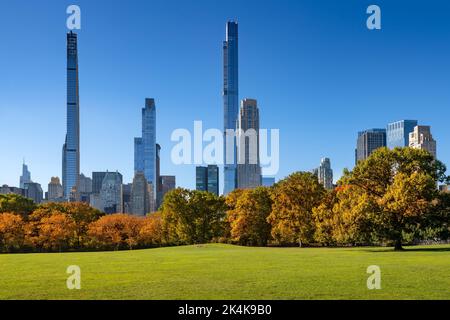 Central Park in Fall with Billionaires Row skyscrapers from Sheep Meadow. Midtown Manhattan, New York City Stock Photo