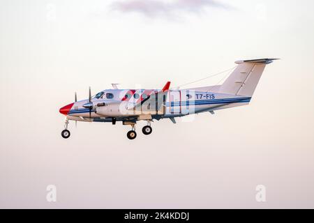 ACAM Flight Calibration Services Aircraft: Beechcraft 200 Super King Air (REG: T7-FIS) landing in the sunset. Stock Photo