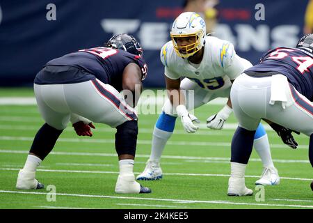 Los Angeles Chargers defensive tackle Sebastian Joseph-Day (69) and  linebacker Troy Reeder (42) tackle Seattle Seahawks quarterback Sean  Mannion (9) in the end zone for a safety during the second half of