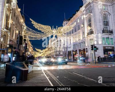 Regent Street Christmas lights, London. The seasonal illuminations at dusk in central London during the holiday season. Stock Photo