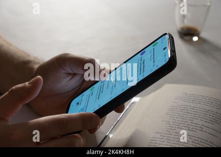 Caucasian man reading mail on his phone Stock Photo