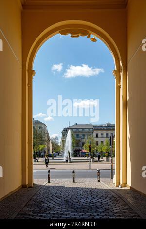 View of the Luisenplatz through the Brandenburg Gate in Potsdam Stock Photo