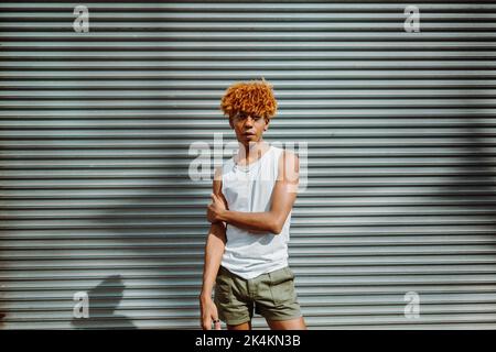 portrait of handsome teen man with nice appearance and stylish makeup posing to the camera Stock Photo