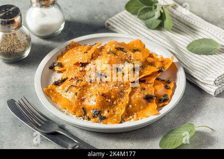 Homemade Butternut Squash Ravioli Pasta with Sage and Brown Butter Stock Photo
