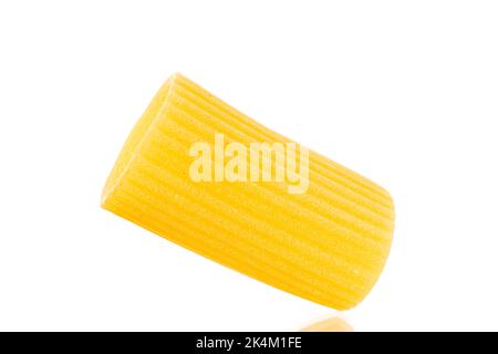 One raw yellow cannelloni, macro, isolated on white background. Stock Photo