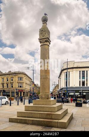 Market Cross in Market Place, looking north towards Kirkgate. Huddersfield. West Yorkshire. Stock Photo