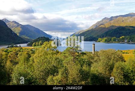 A view of Loch Shiel with the Glenfinnan Monument in the foreground in Glenfinnan, Morar, Scotland, United Kingdom. Stock Photo