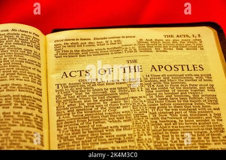 Close up of antique Holy Bible page, shallow depth of field with focus on chapter title heading, The Acts of the Apostles Stock Photo