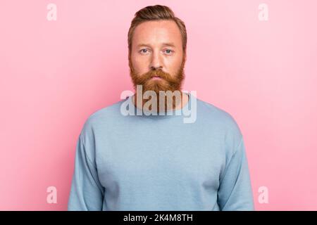 Photo of young attractive handsome bearded redhair man serious look you professional worker isolated on pink color background Stock Photo