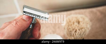 Horizontal banner or header with close-up of safety razor 50s style and male cosmetic products and supplies used by men to shave. Safety razor, shavin Stock Photo